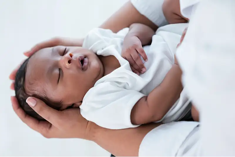 babys-health-accent Baby Health Accent Image showing newborn being examined by healthcare provider