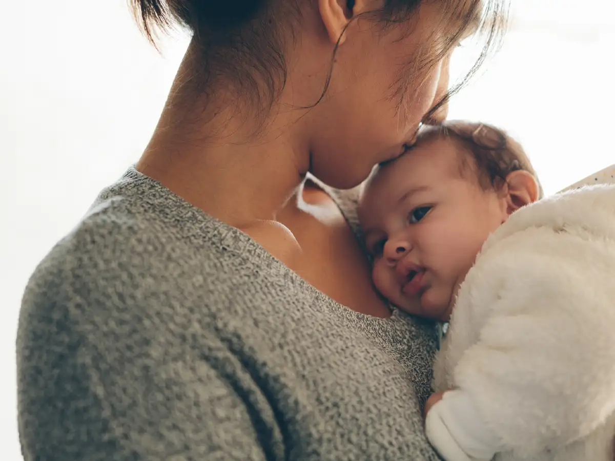 Services Hero Image showing mother holding baby